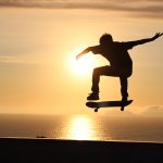 Why Do They Love Skateboarding? silhouette of man jumping on mid air during sunset