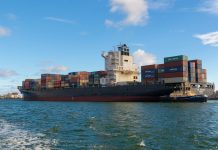 Navigating the Seas of Financial Protection: Marine Cargo Insurance and the Digital Realm black cargo ship on sea under blue sky during daytime