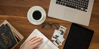 Essential Legal Documents Every Entrepreneur Needs person holding ballpoint pen writing on notebook