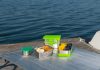 Choosing the Best Eco-Friendly Food Containers for the Green Packaging Revolution a picnic table with food on it near a body of water