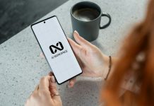 AI Operations Reshaping IT Management Woman holding smartphone with ai workspace logo.