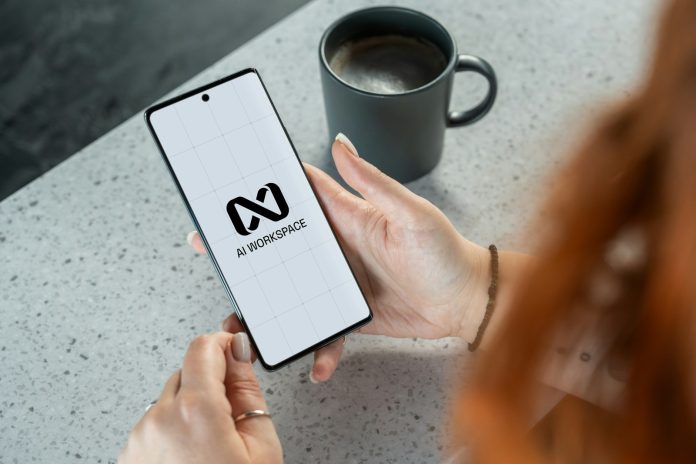 Woman holding smartphone with ai workspace logo.