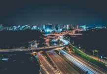 Modern Infrastructure and Wellness in High Density Urban Living time lapse photo of concrete highway with cars