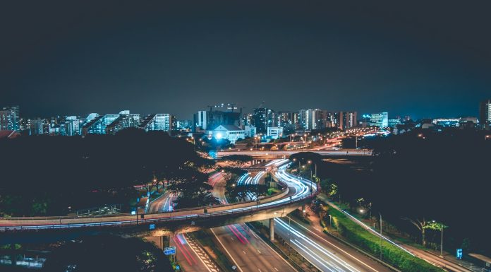 Modern Infrastructure and Wellness in High Density Urban Living time lapse photo of concrete highway with cars