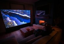 How Physical Play Is Changing Home Entertainment A person sitting on a couch in front of a flat screen TV