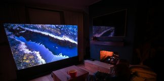 How Physical Play Is Changing Home Entertainment A person sitting on a couch in front of a flat screen TV