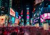 Deconstructing Relentless Work Culture in Hong Kong time-lapse photography of crowd of people on New York Time square during night time